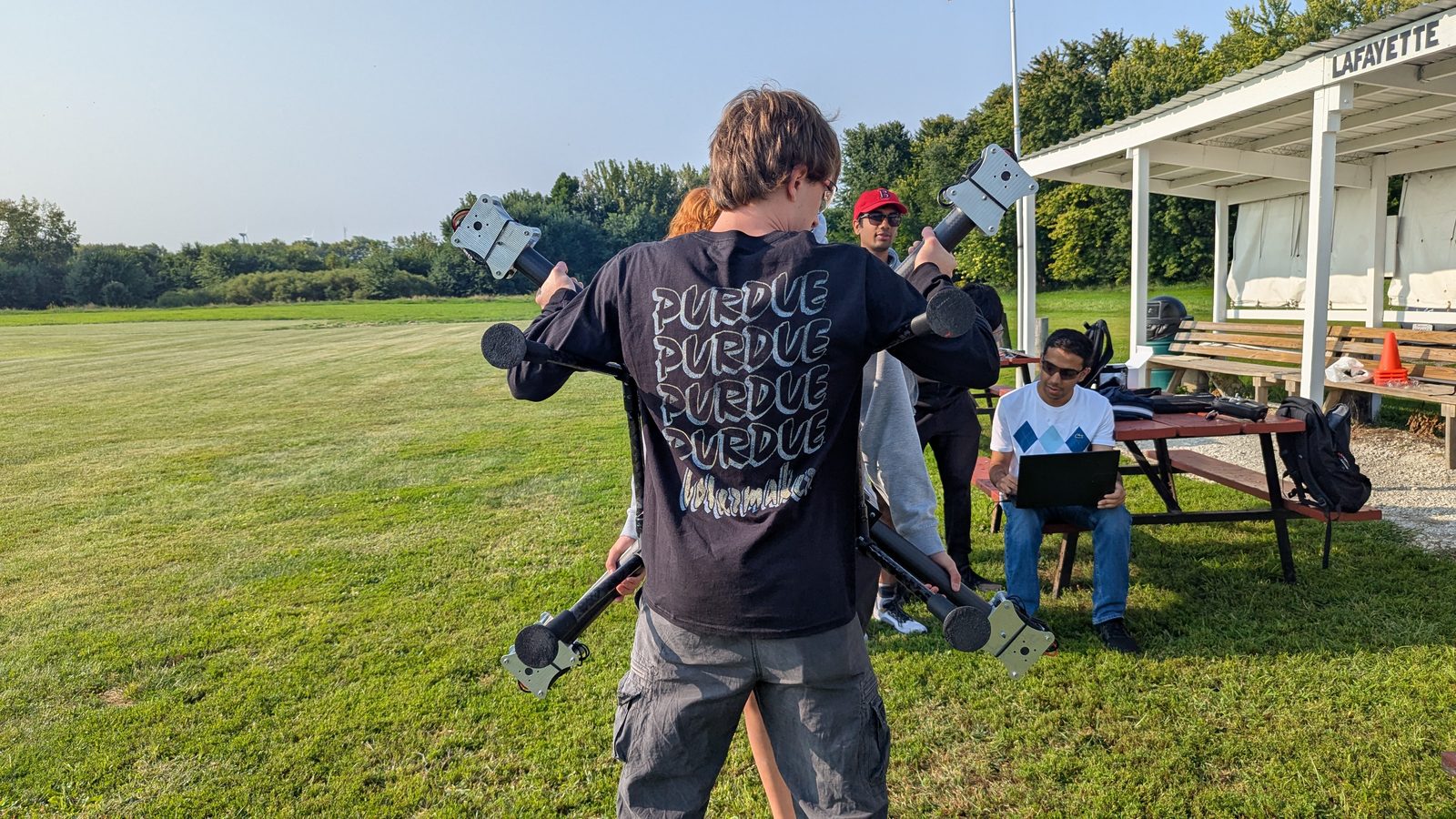 A VFS member carrying a subscale prototype at the flight field