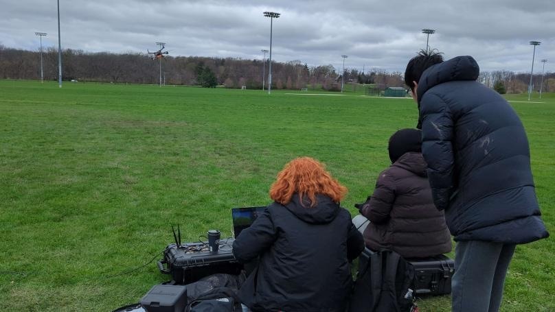 VFS members monitoring a prototype flight from a ground station at the test field